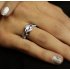 Stříbrný prsten se zirkony - proplétaný
